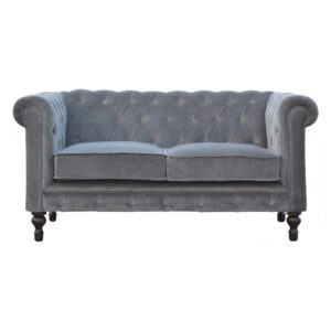 A sofa in grey velvet Chesterfield